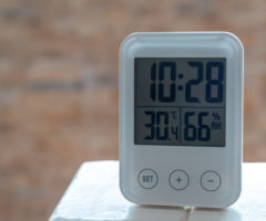clock with humidity sensor on table